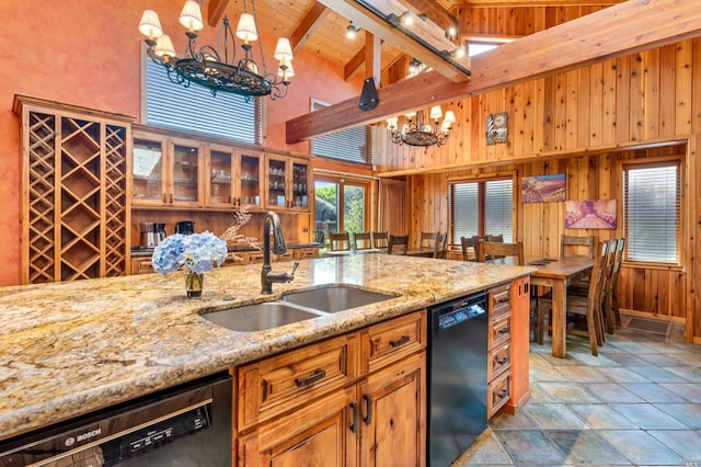 kitchen featuring an inviting chandelier, dishwasher, decorative light fixtures, high vaulted ceiling, and dishwashing machine