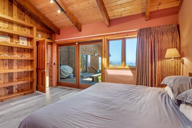 bedroom with access to exterior, light hardwood / wood-style flooring, wood ceiling, and lofted ceiling with beams