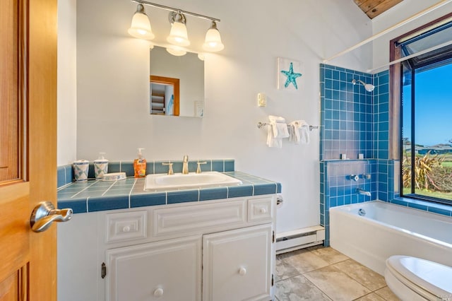 full bathroom with tile floors, tiled shower / bath combo, a baseboard radiator, toilet, and vanity