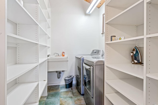 laundry area featuring tile flooring and independent washer and dryer