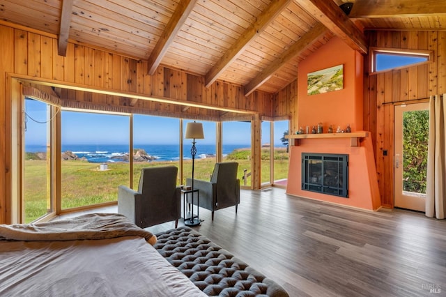 bedroom with wooden ceiling, wood walls, beamed ceiling, dark hardwood / wood-style floors, and a water view