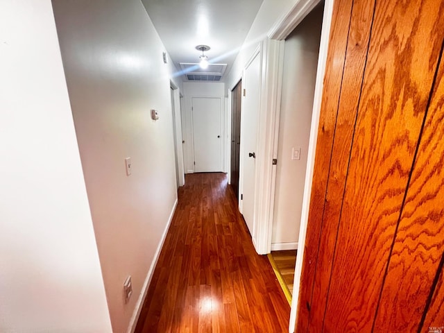 corridor with dark wood-type flooring