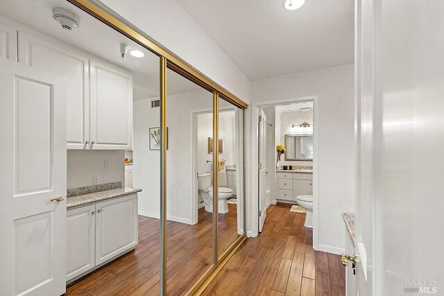 hall with dark hardwood / wood-style flooring