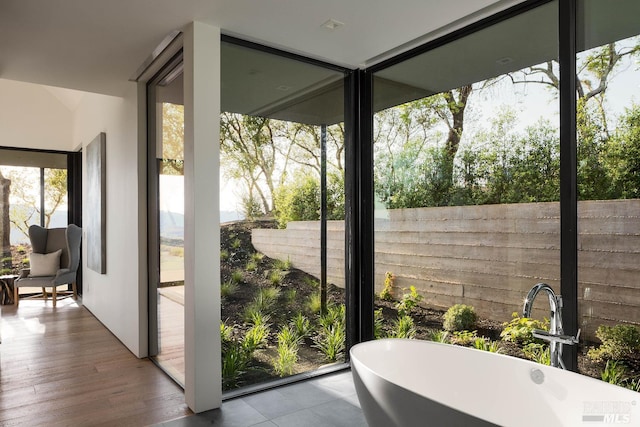 sunroom featuring a sink