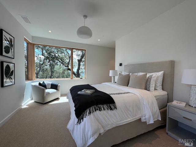 carpeted bedroom with baseboards, visible vents, and recessed lighting