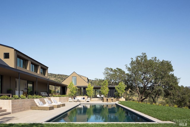 pool featuring a patio area