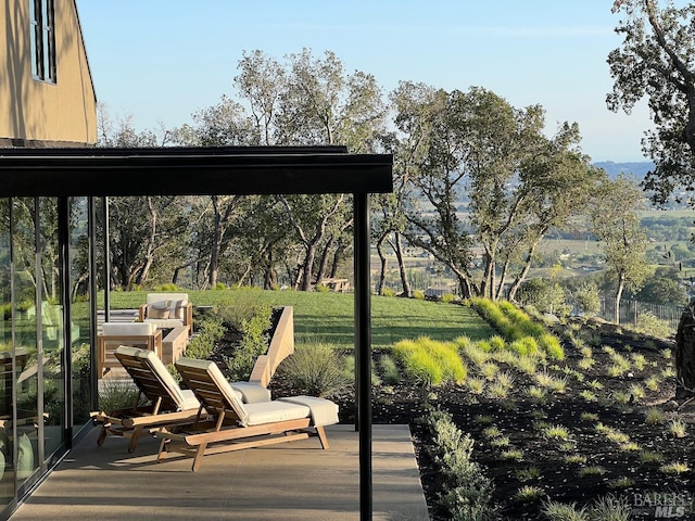 surrounding community with a yard and a patio area