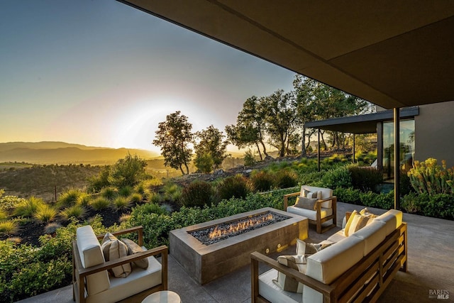 view of patio / terrace featuring an outdoor living space with a fire pit