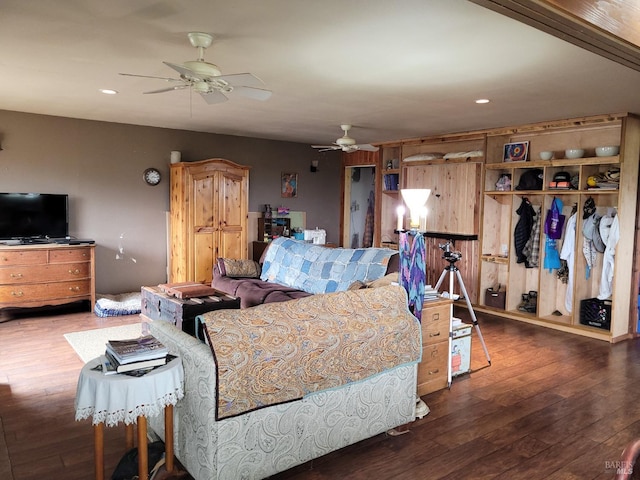 bedroom featuring dark hardwood / wood-style floors, a closet, and ceiling fan