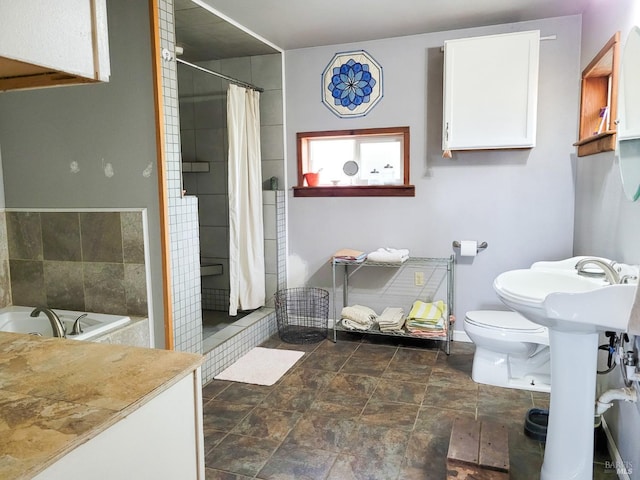 bathroom featuring walk in shower and toilet