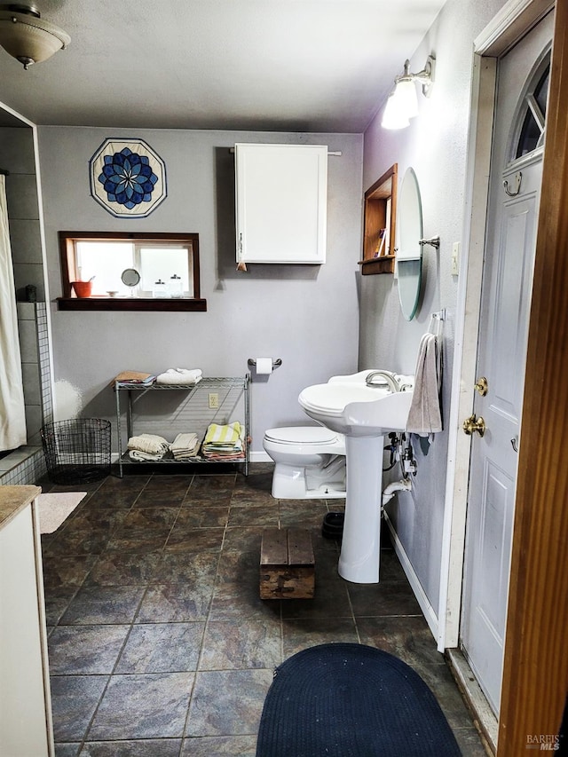 bathroom featuring toilet