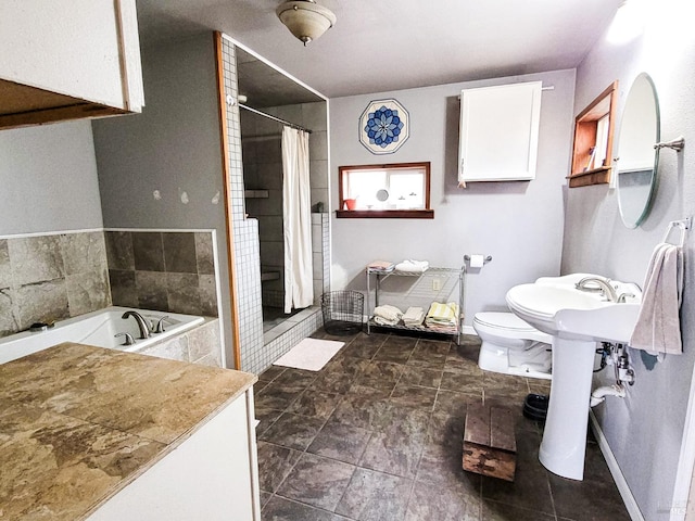 bathroom with separate shower and tub and toilet