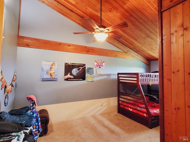 carpeted bedroom with ceiling fan, wooden ceiling, and vaulted ceiling