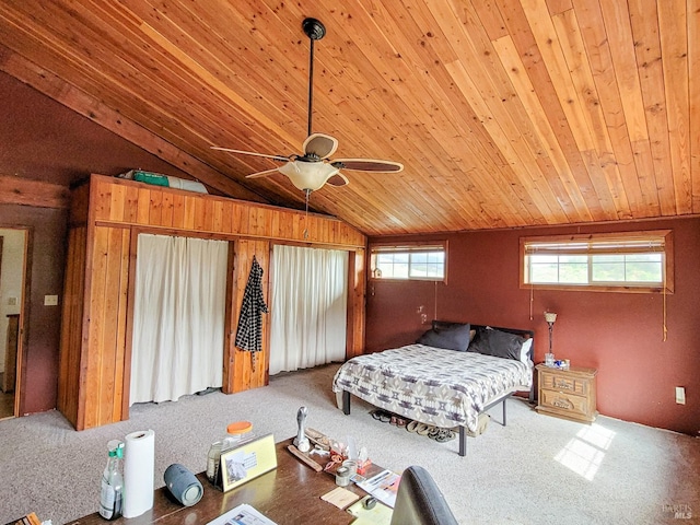 bedroom with ceiling fan, carpet floors, wood ceiling, and vaulted ceiling