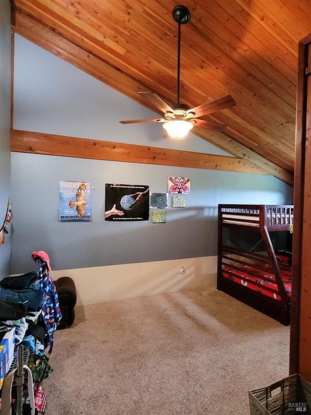 bedroom with carpet floors, vaulted ceiling, and wood ceiling