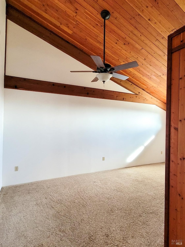 empty room with ceiling fan, carpet floors, and vaulted ceiling