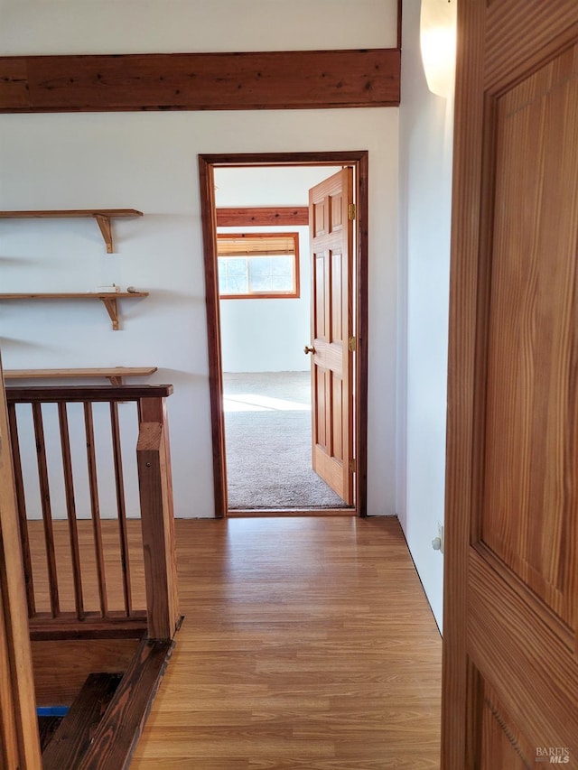 hallway with light hardwood / wood-style flooring