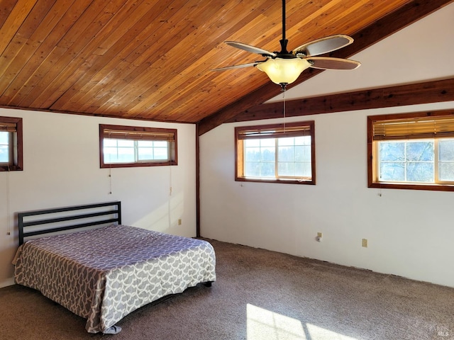 unfurnished bedroom featuring ceiling fan, carpet, wooden ceiling, and vaulted ceiling