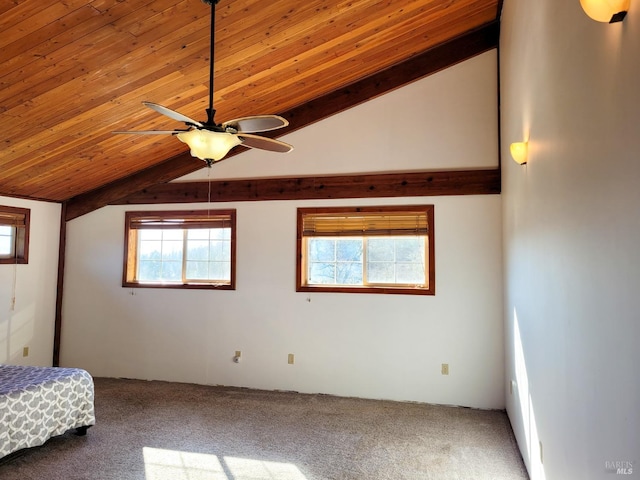 unfurnished bedroom featuring ceiling fan, carpet floors, wood ceiling, and vaulted ceiling