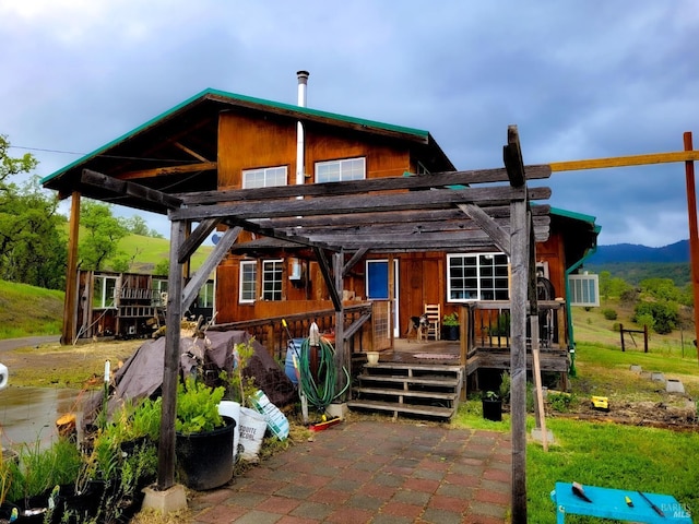 rear view of house with a pergola