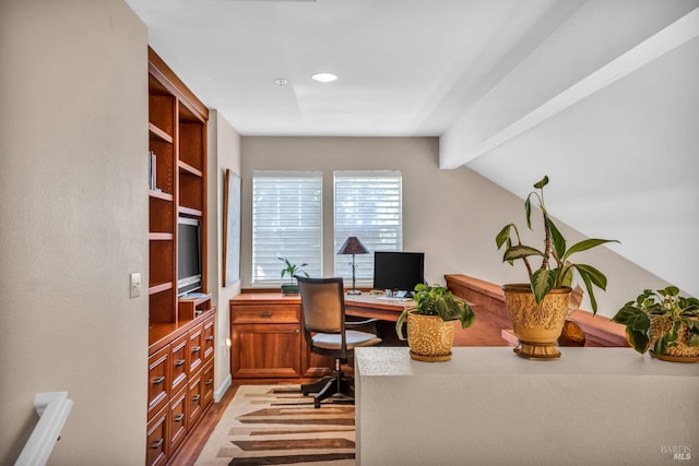 office with lofted ceiling with beams and light hardwood / wood-style floors