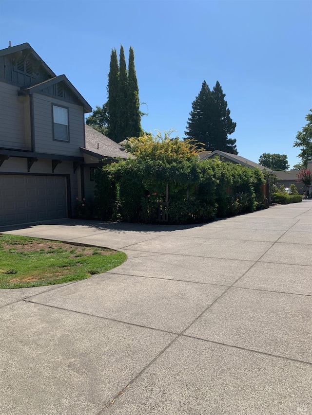 view of side of home with a garage