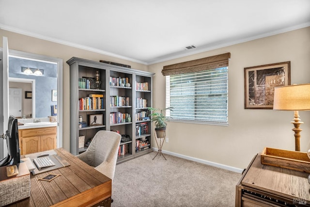 home office with light carpet and crown molding