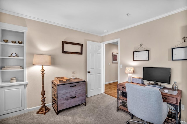 office area featuring light colored carpet and crown molding