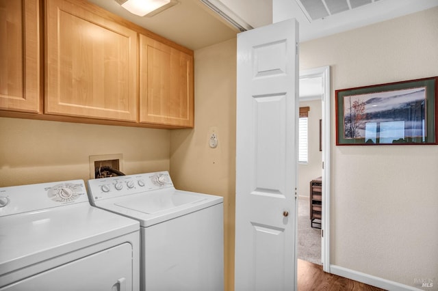 washroom with cabinets, washer and clothes dryer, dark colored carpet, and hookup for a washing machine