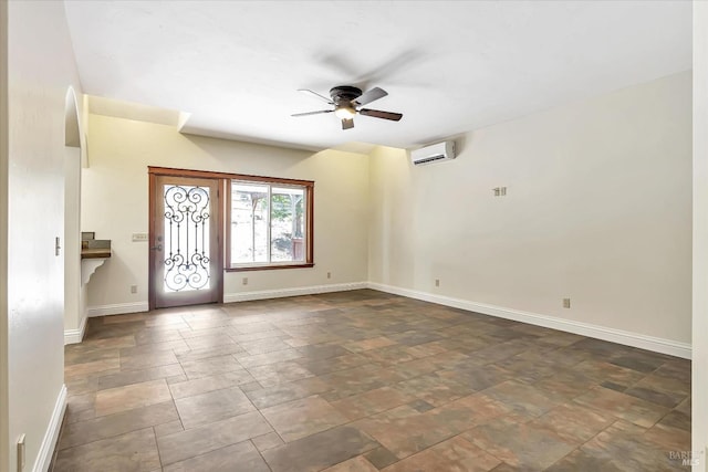 foyer entrance featuring ceiling fan, an AC wall unit, and tile patterned floors