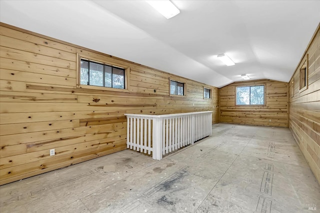 additional living space featuring vaulted ceiling