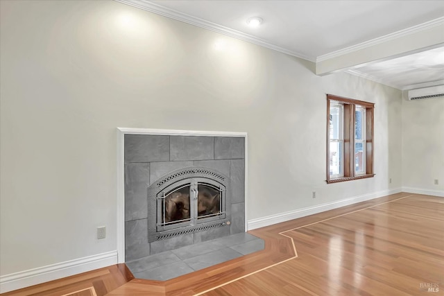 unfurnished living room with light hardwood / wood-style floors, a tiled fireplace, ornamental molding, and a wall unit AC