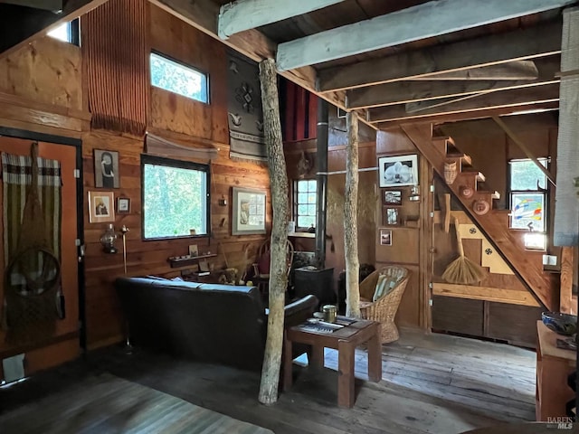 interior space with wood walls and dark wood-type flooring