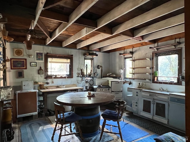 dining area with beamed ceiling