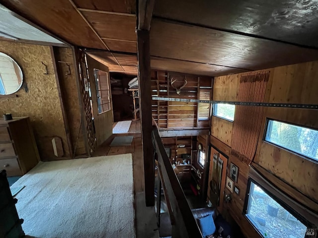 interior space featuring wood walls