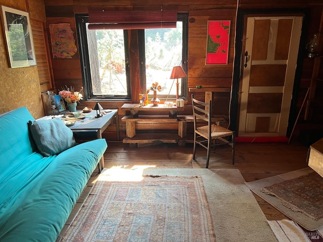 living room with wood walls and dark hardwood / wood-style floors