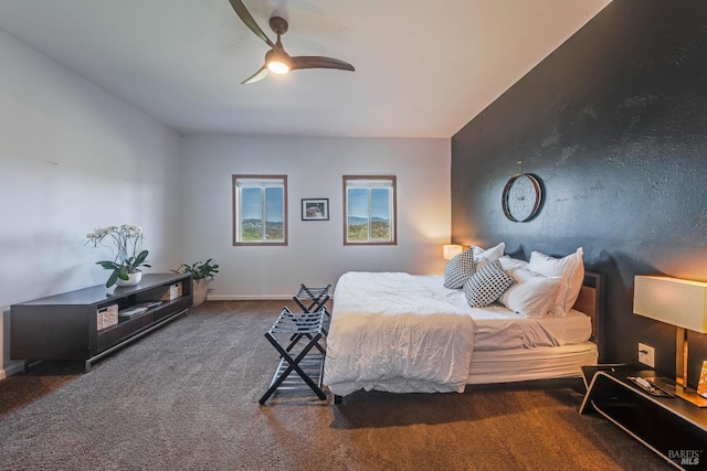 bedroom featuring dark carpet and ceiling fan