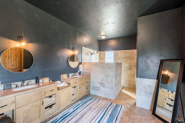 bathroom with double vanity and tile flooring