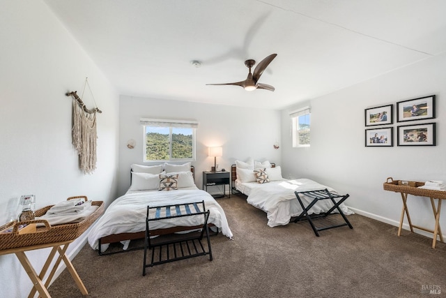 bedroom featuring dark colored carpet and ceiling fan