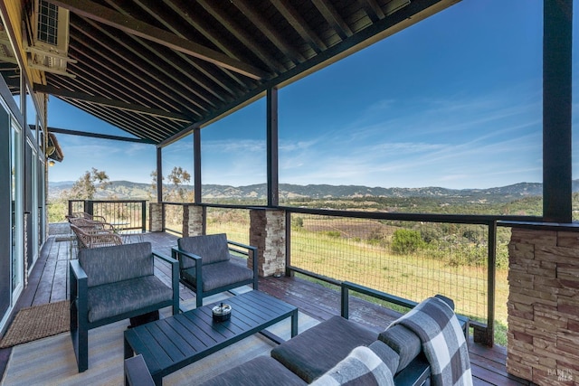 exterior space featuring an outdoor living space and a deck