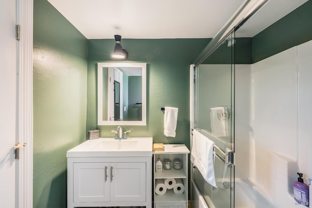 bathroom featuring enclosed tub / shower combo and oversized vanity