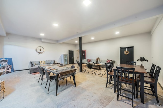 dining room with beam ceiling