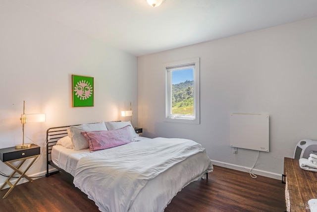 bedroom featuring dark hardwood / wood-style flooring