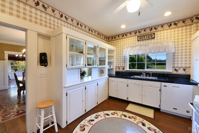 kitchen featuring white cabinetry, dishwasher, and sink