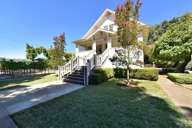 view of front of home featuring a front lawn and a porch