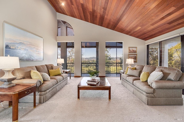living room with high vaulted ceiling and wooden ceiling