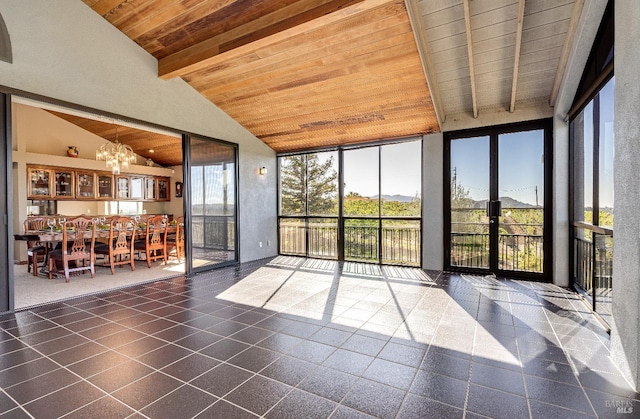 unfurnished sunroom featuring wooden ceiling, french doors, vaulted ceiling with beams, and a chandelier