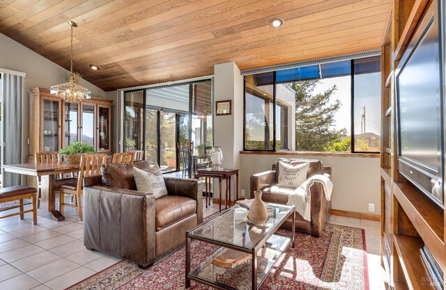 tiled living room with lofted ceiling, plenty of natural light, wooden ceiling, and a notable chandelier