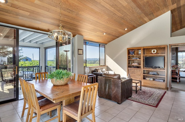 tiled dining room with an inviting chandelier, wood ceiling, and plenty of natural light