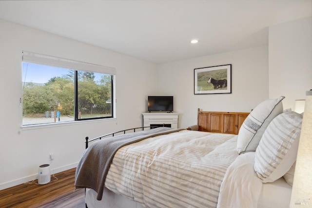 bedroom featuring dark hardwood / wood-style flooring